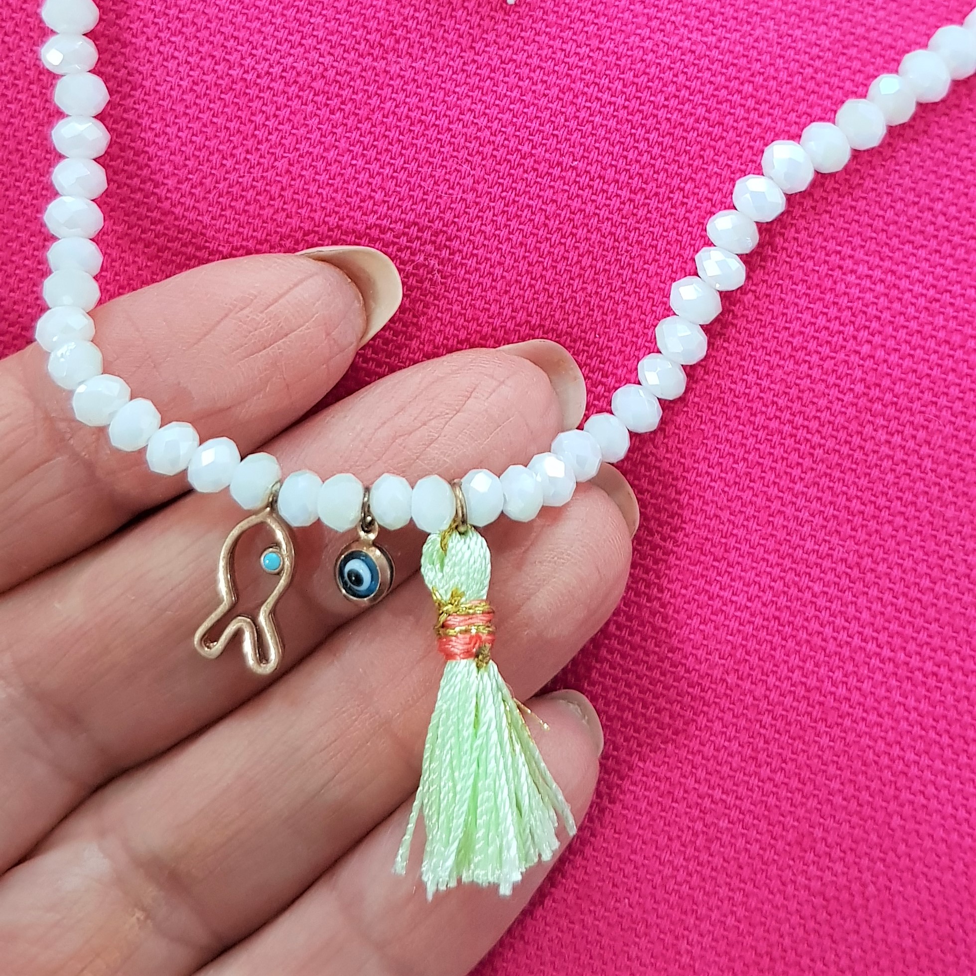 close up white bead necklace
